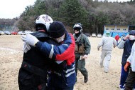 'Sailor is embraced by Japanese citizen after+delivering+supplies.'flickrcc.net